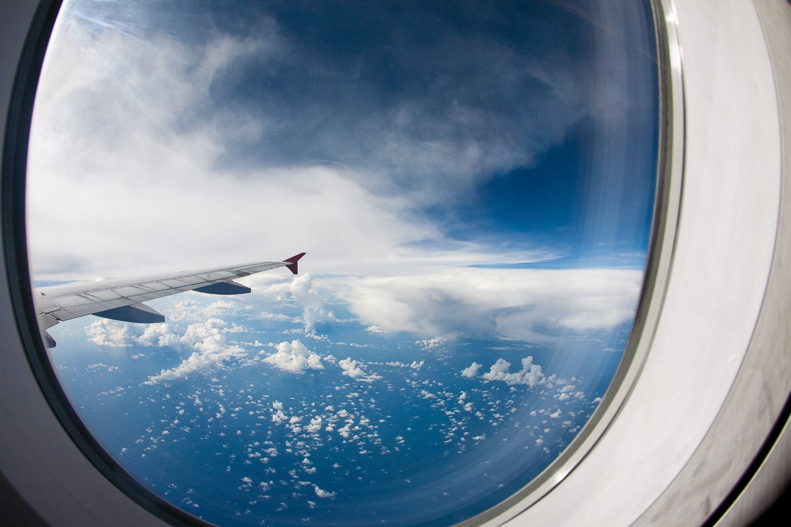 flying in an airplane, looking out the window, sea underneath