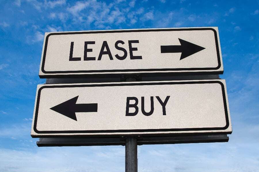 nuy or lease road sign